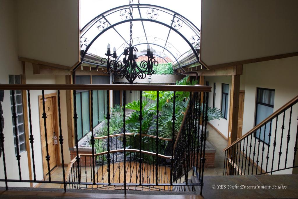 a building with a balcony with a chandelier at Apartotel Don Francisco in San José