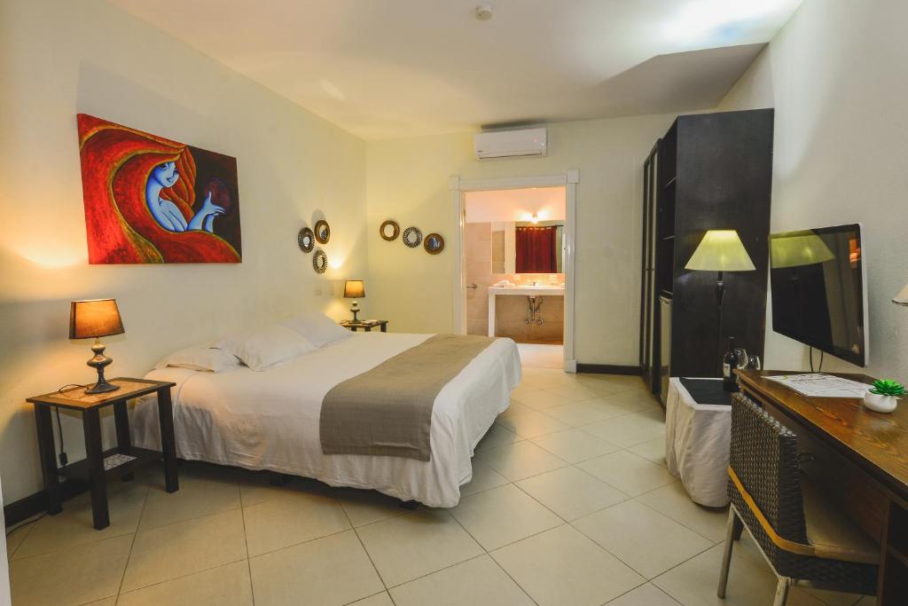 Postel nebo postele na pokoji v ubytování Hotel Luisiana