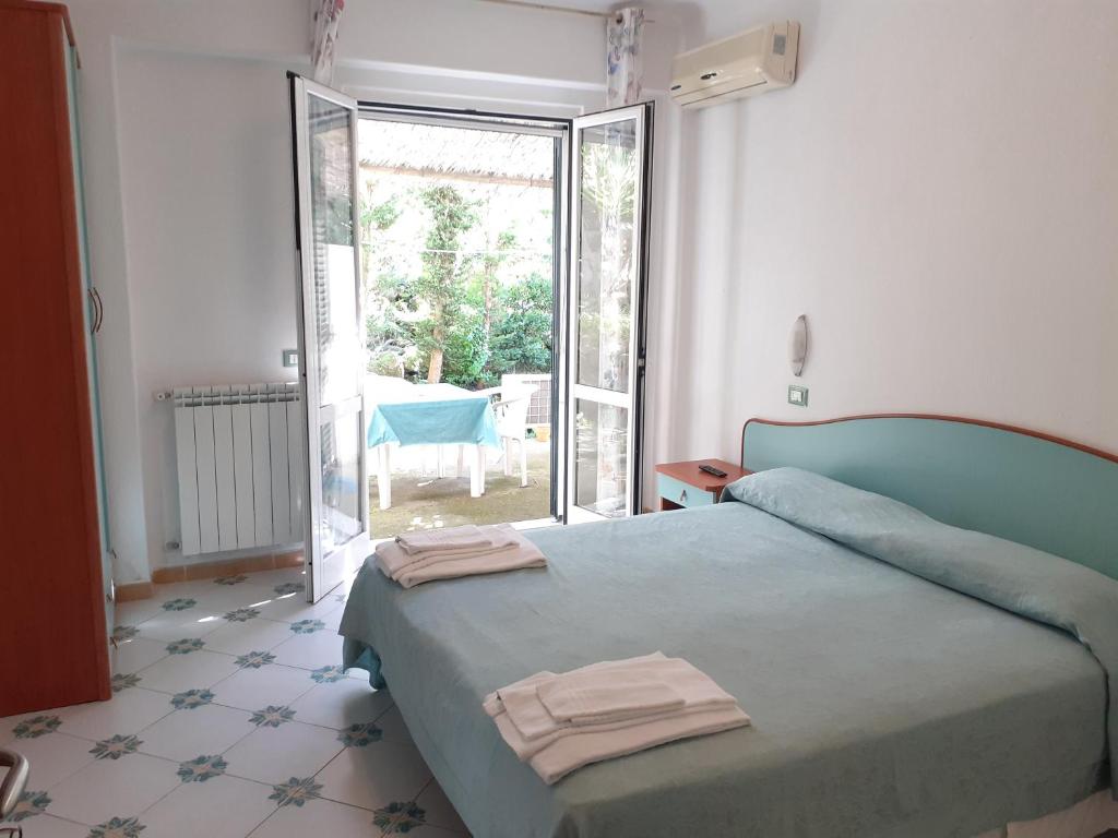 Postel nebo postele na pokoji v ubytování Paco Residence Benessere & Relax