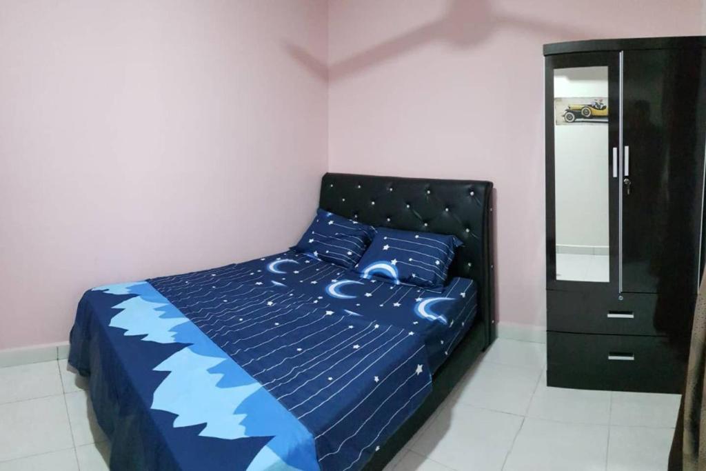 Postel nebo postele na pokoji v ubytování DinDas Family Stay @ Labuan