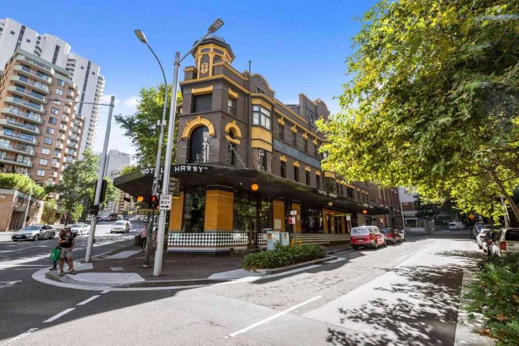 a building on the corner of a city street at Hotel Harry, Ascend Hotel Collection in Sydney