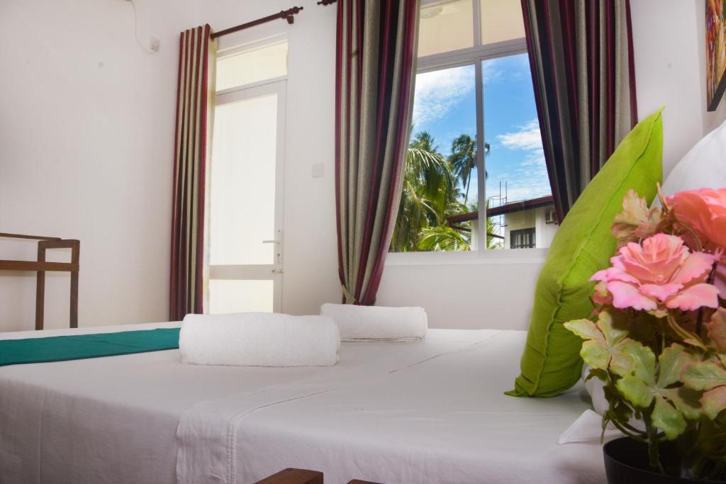 Postel nebo postele na pokoji v ubytování Di Sicuro Tourist Inn