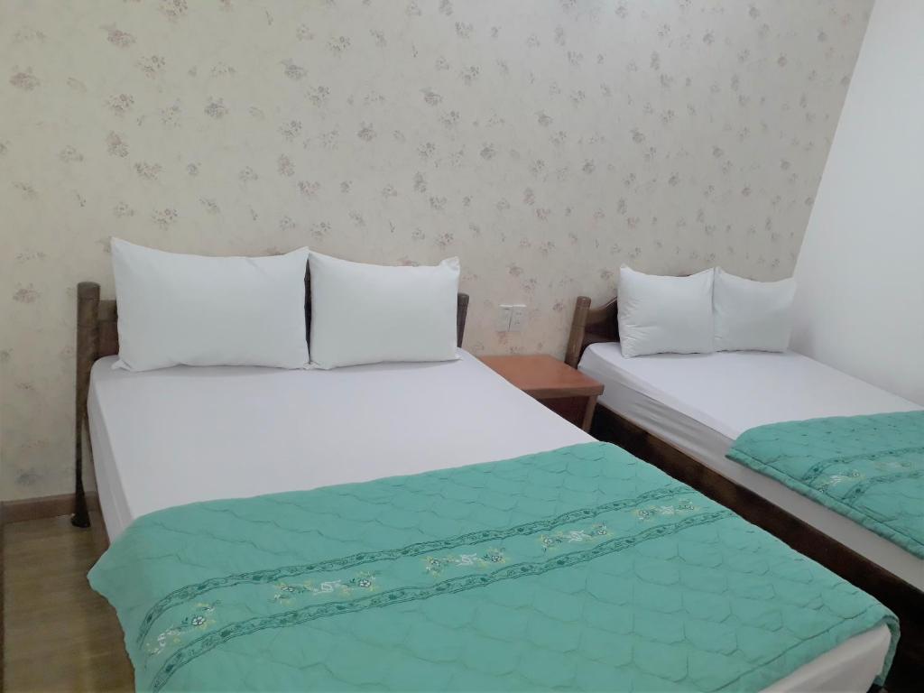 Postel nebo postele na pokoji v ubytování Blue Sea Hotel 2