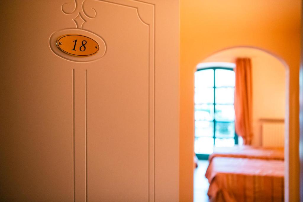 Postel nebo postele na pokoji v ubytování Le Lanterne
