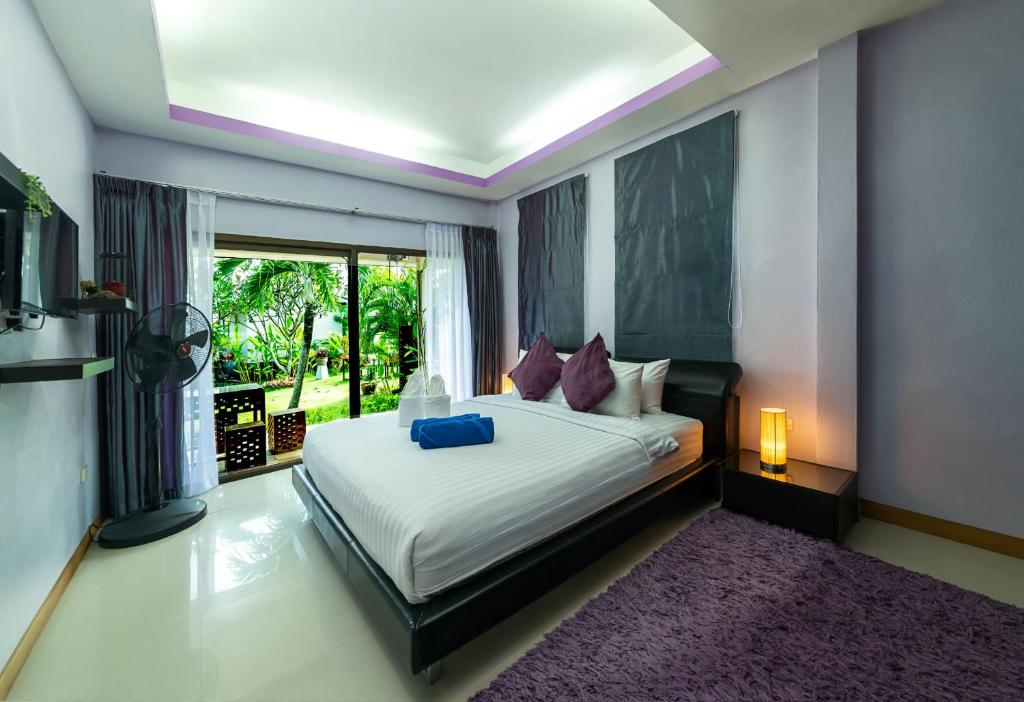 Postel nebo postele na pokoji v ubytování Phangan Beach Resort