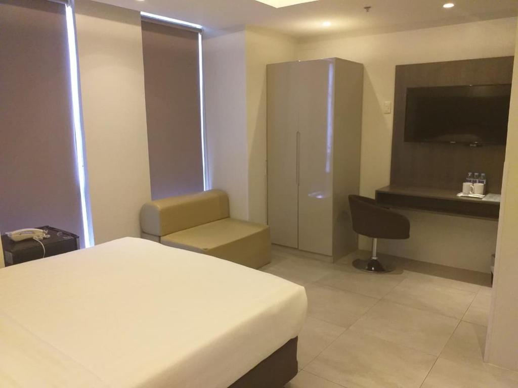 TV a/nebo společenská místnost v ubytování Mabolo Royal Hotel