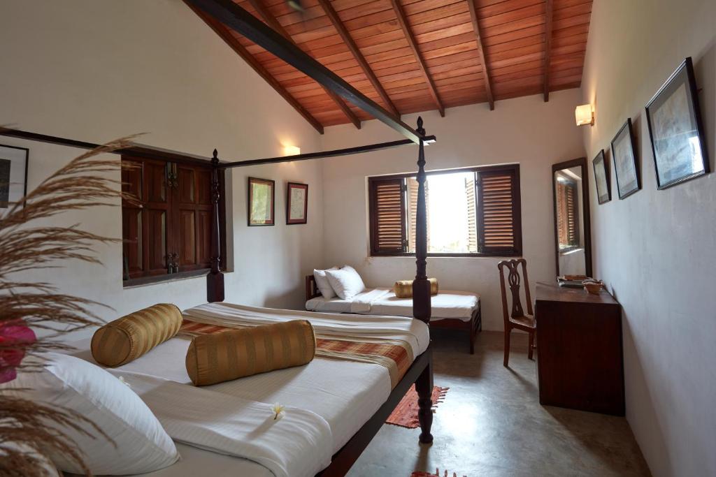 Postel nebo postele na pokoji v ubytování Villa Sunbird Negombo