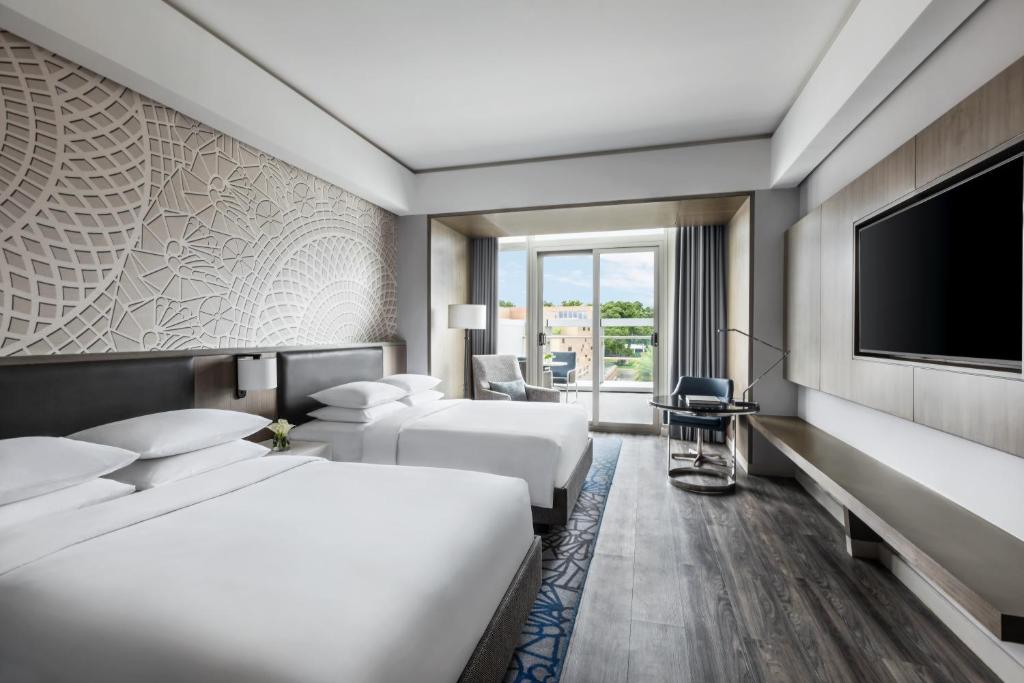Voodi või voodid majutusasutuse Clark Marriott Hotel toas