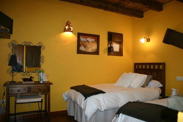 A bed or beds in a room at Hotel Rural El Marquesito Antigua Casa Carmela