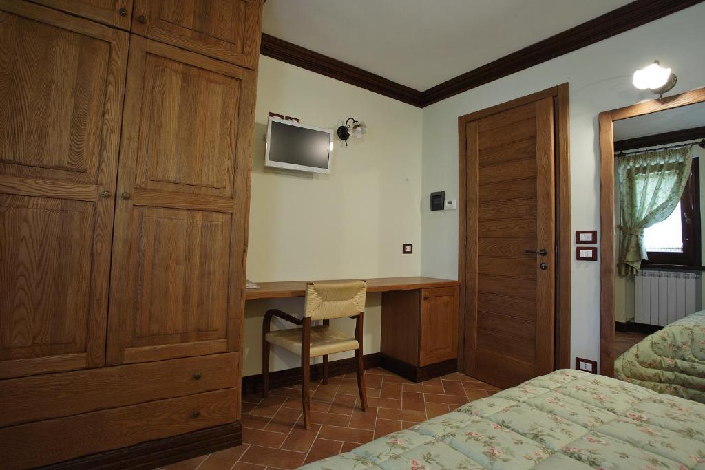 Łóżko lub łóżka w pokoju w obiekcie B&B IL PINO