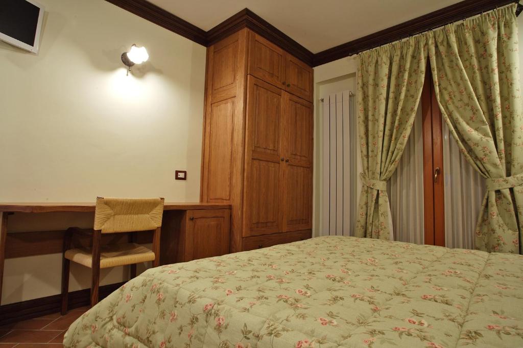 Łóżko lub łóżka w pokoju w obiekcie B&B IL PINO