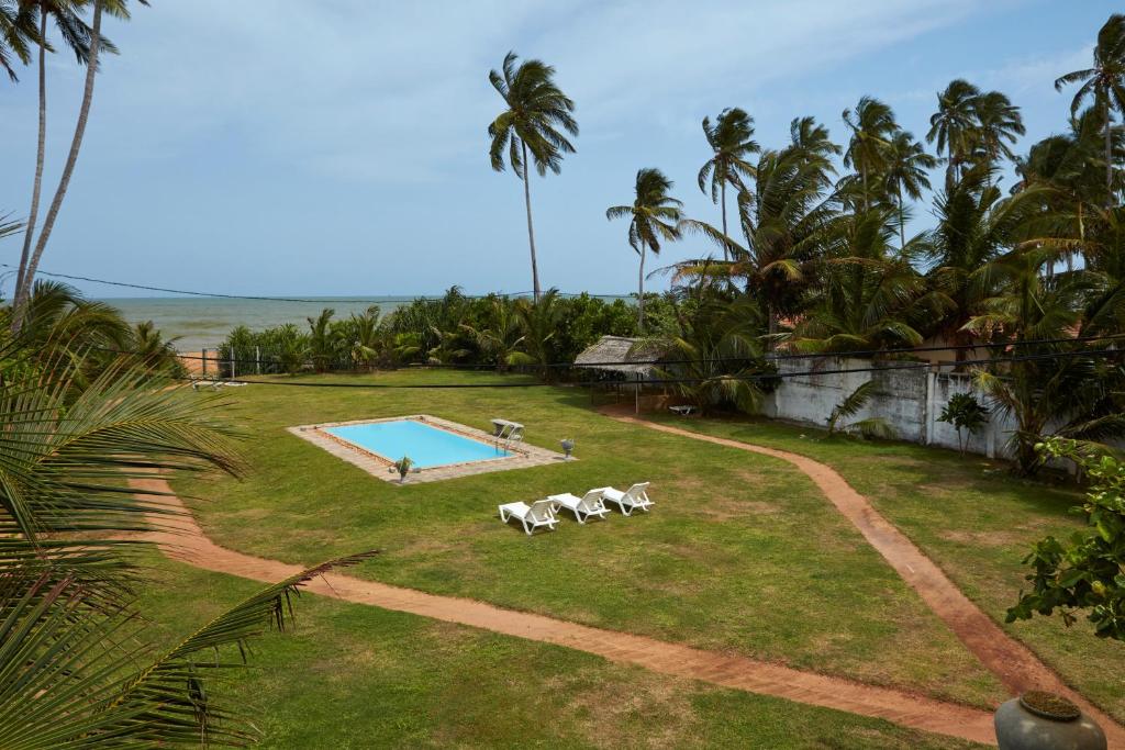 Bazén v ubytování Villa Sunbird Negombo nebo v jeho okolí