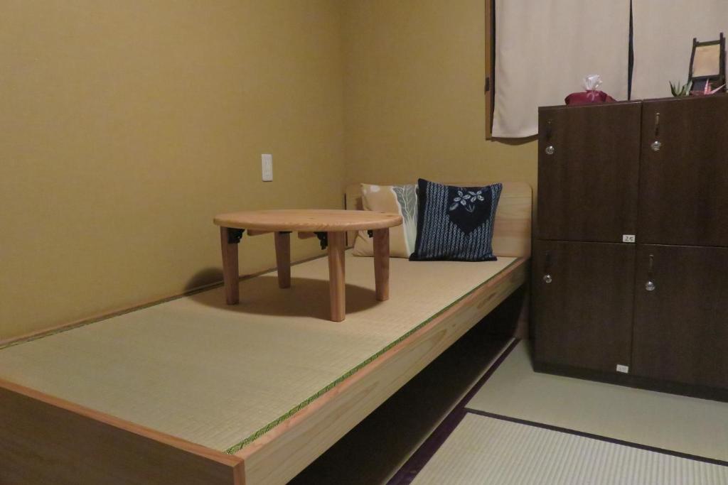 Postel nebo postele na pokoji v ubytování Guest House Nakaima