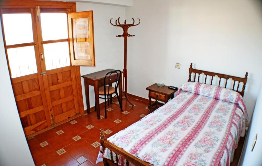 Postel nebo postele na pokoji v ubytování Mesón de Lagartera