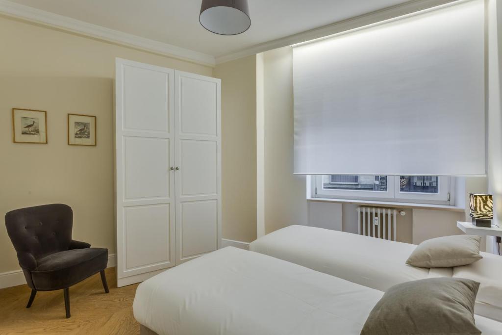 Łóżko lub łóżka w pokoju w obiekcie Sophisticated Home