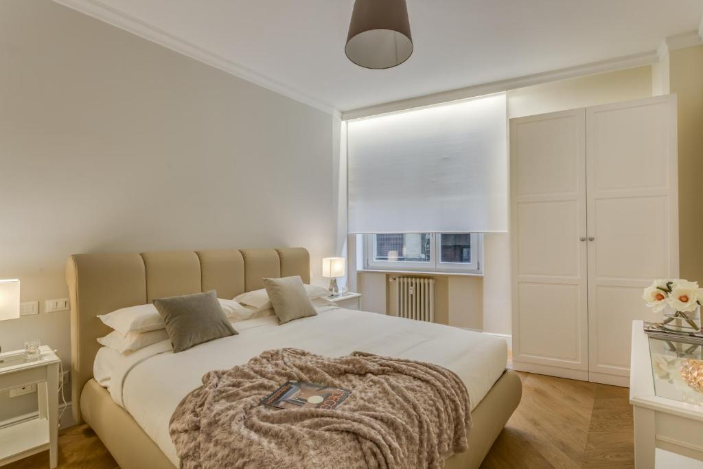 Łóżko lub łóżka w pokoju w obiekcie Sophisticated Home