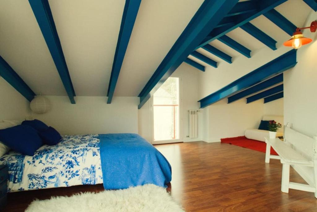 A bed or beds in a room at La Postoca