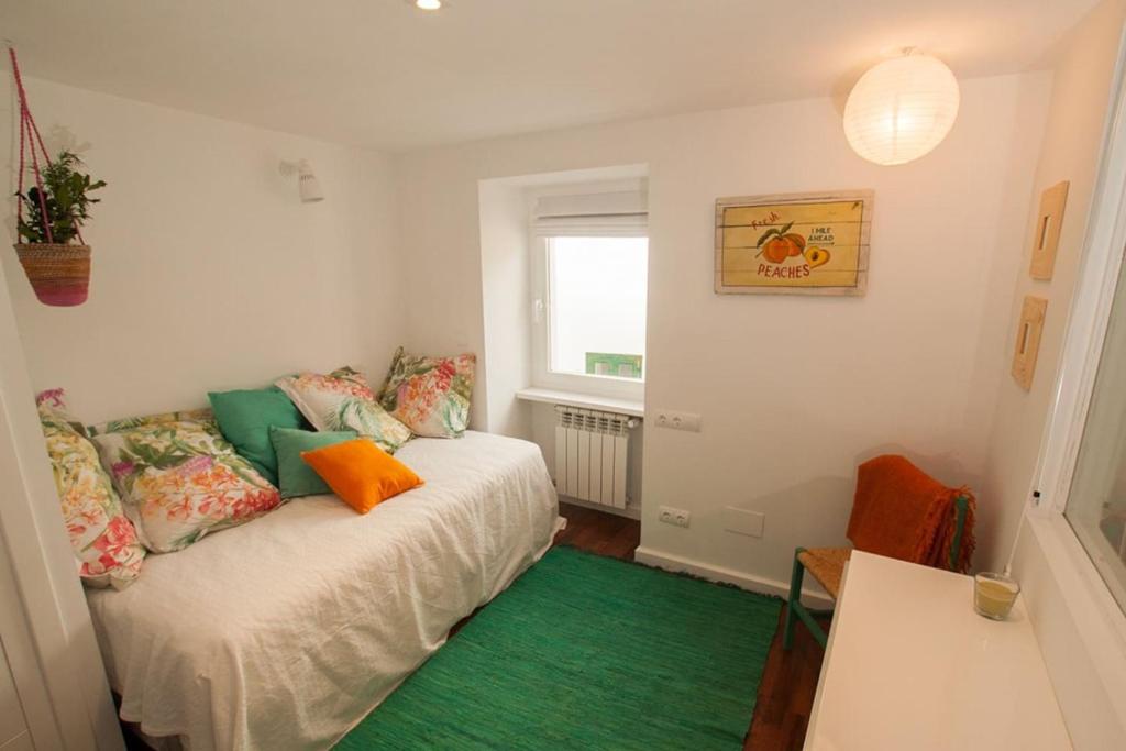 A bed or beds in a room at La Postoca