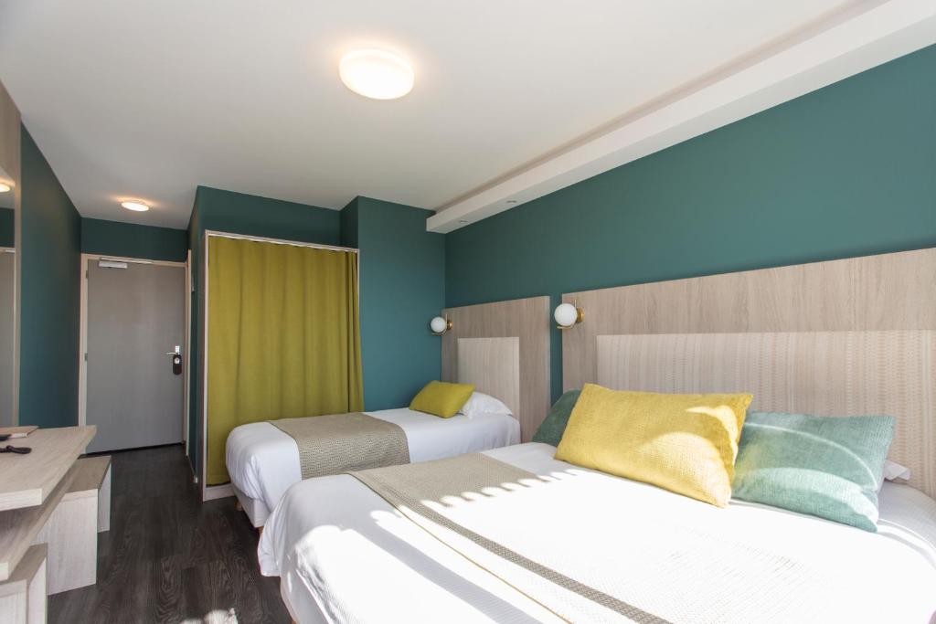 Postel nebo postele na pokoji v ubytování Hôtel-Restaurant Bois Joly