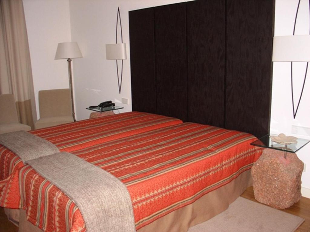 Postel nebo postele na pokoji v ubytování Hotel Convento dos Capuchos