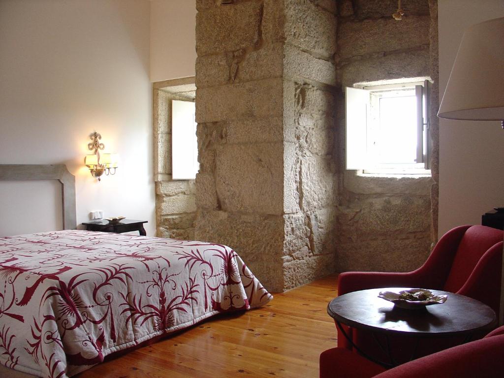 Postel nebo postele na pokoji v ubytování Hotel Convento dos Capuchos