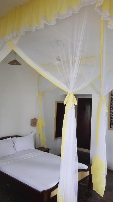 Postel nebo postele na pokoji v ubytování Makuti Villas Resort
