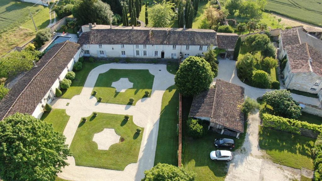an aerial view of a house with a golf estate at Domaine de Rennebourg in Saint Denis Du Pin