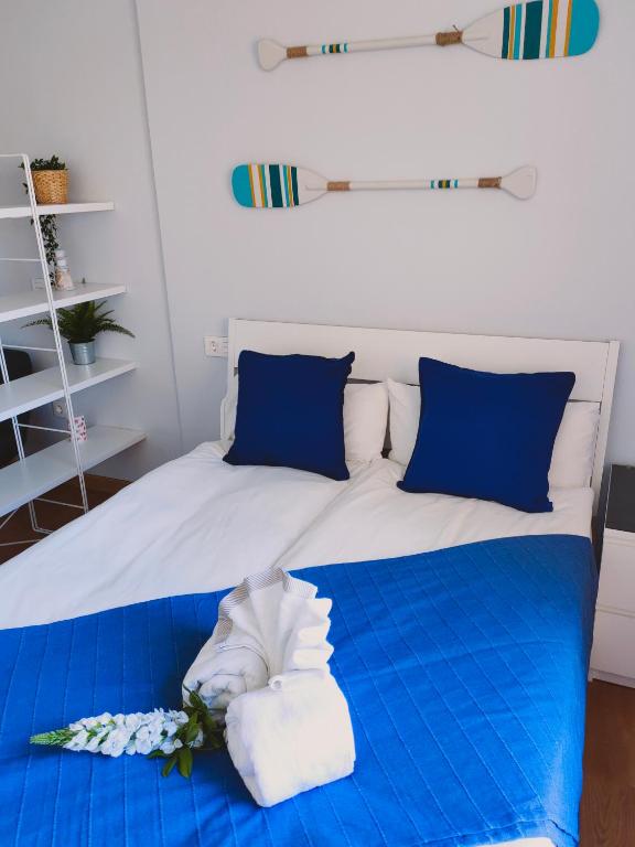 Postel nebo postele na pokoji v ubytování La Perla Apartment BY NAMASTE ELITE