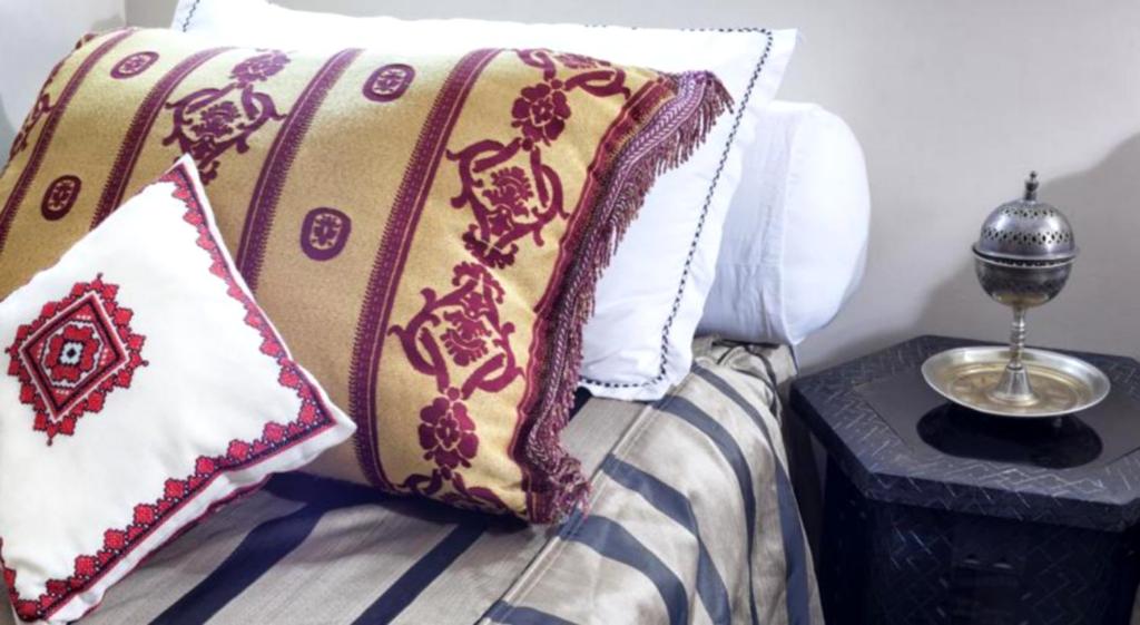 Postel nebo postele na pokoji v ubytování Hotel Azoul