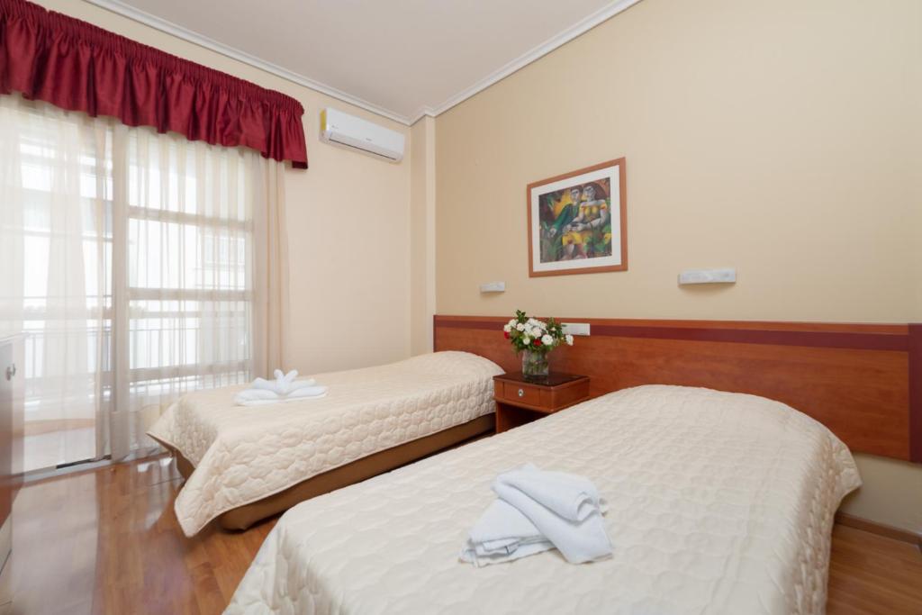 Postel nebo postele na pokoji v ubytování Lido Hotel