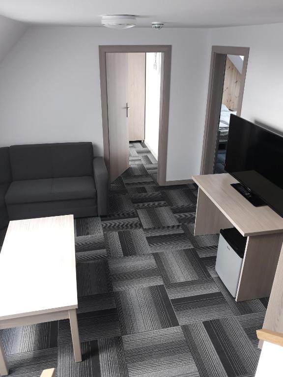 Televízia a/alebo spoločenská miestnosť v ubytovaní dask resort