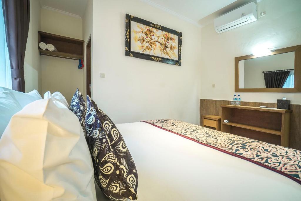 Postel nebo postele na pokoji v ubytování Odi Ode House
