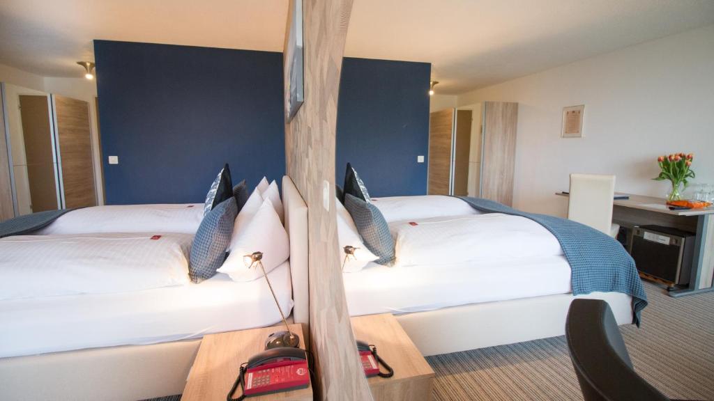 Voodi või voodid majutusasutuse Park - Hotel Inseli toas