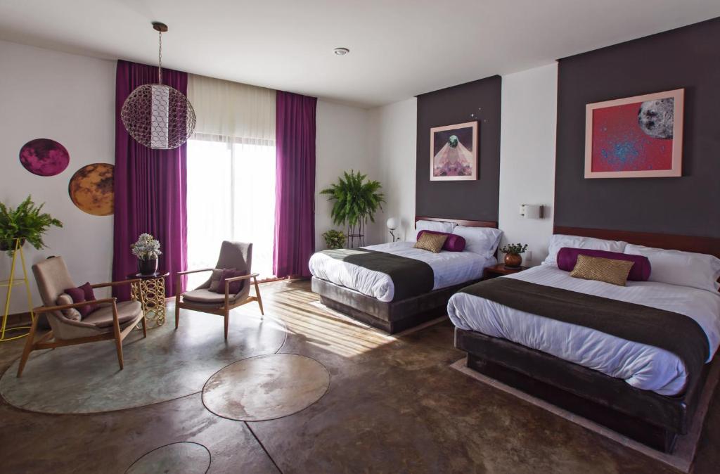 Postel nebo postele na pokoji v ubytování Hotel Casa Delina