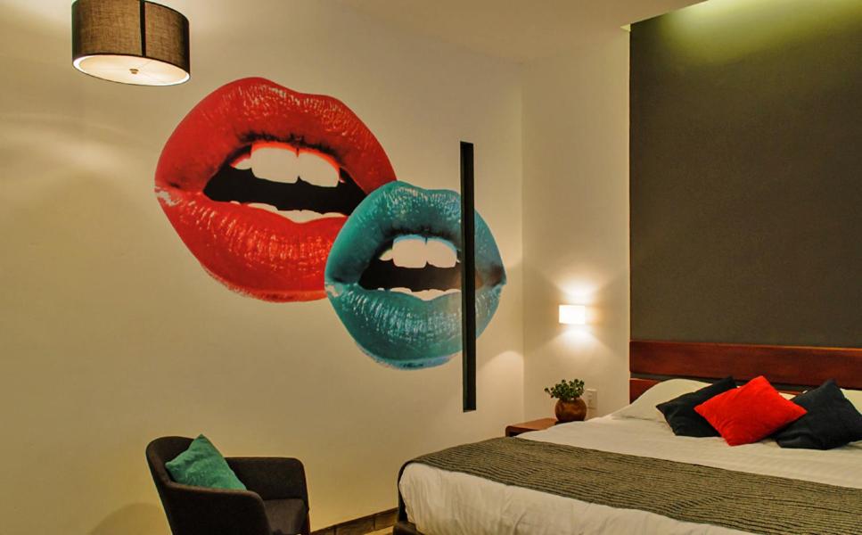 Postel nebo postele na pokoji v ubytování Hotel Casa Delina