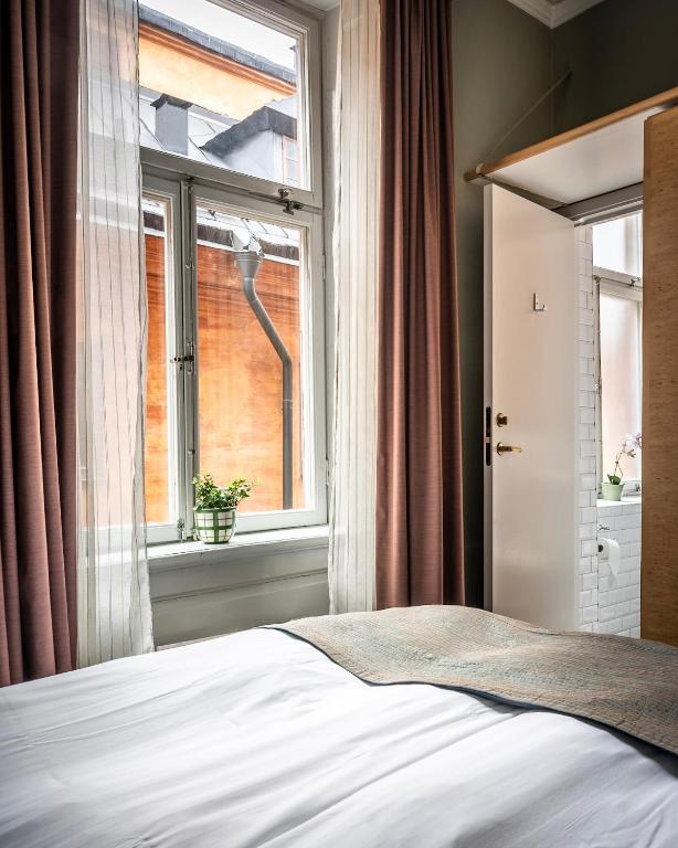 Postel nebo postele na pokoji v ubytování Lady Hamilton Hotel