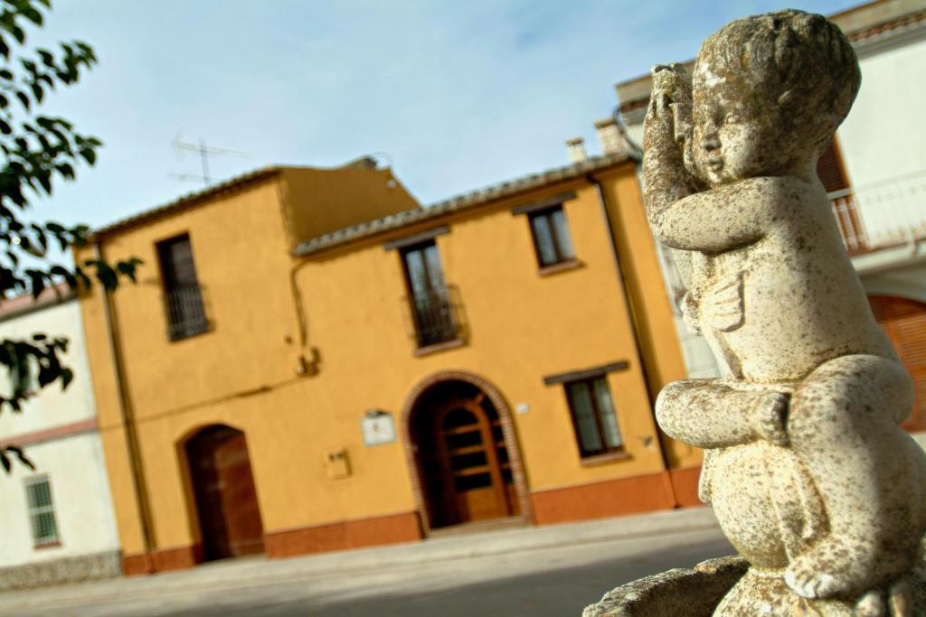 a statue of a rabbit in front of a building at Casa Rural Ca La Siona in Avinyonet