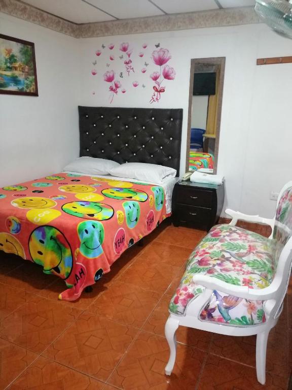 Postel nebo postele na pokoji v ubytování Hotel Mi Casita Pereira