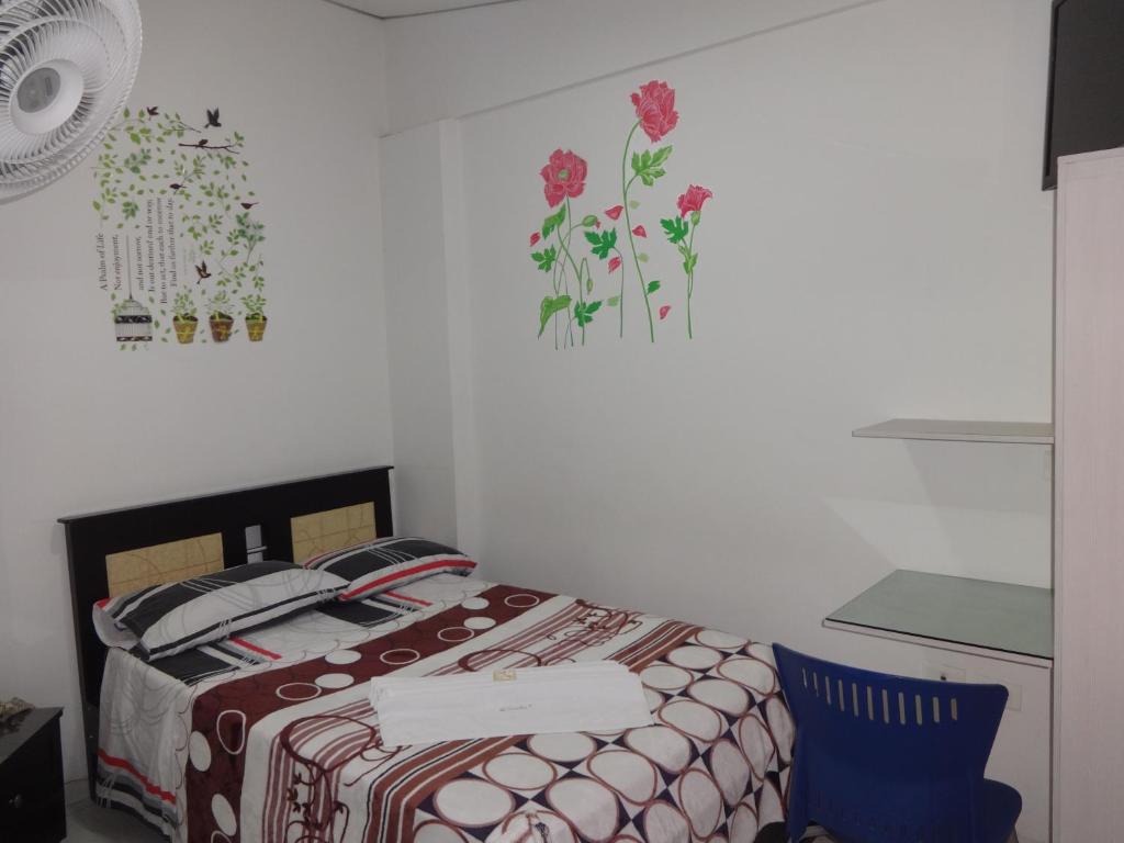 Postel nebo postele na pokoji v ubytování Hotel Mi Casita Pereira