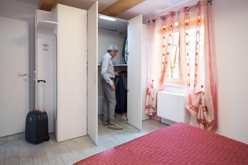 Postel nebo postele na pokoji v ubytování Albergo Diffuso Magredi