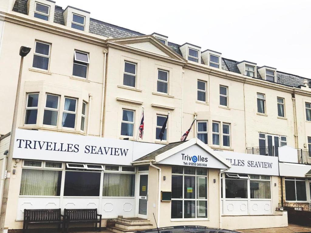 a large white building with a trickles searseway at Trivelles Seaview Blackpool in Blackpool