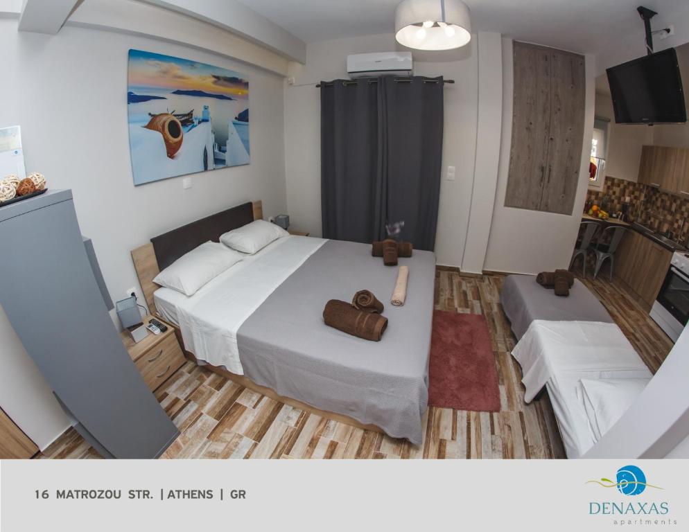 Postel nebo postele na pokoji v ubytování Denaxas Apartments in the heart of Athens