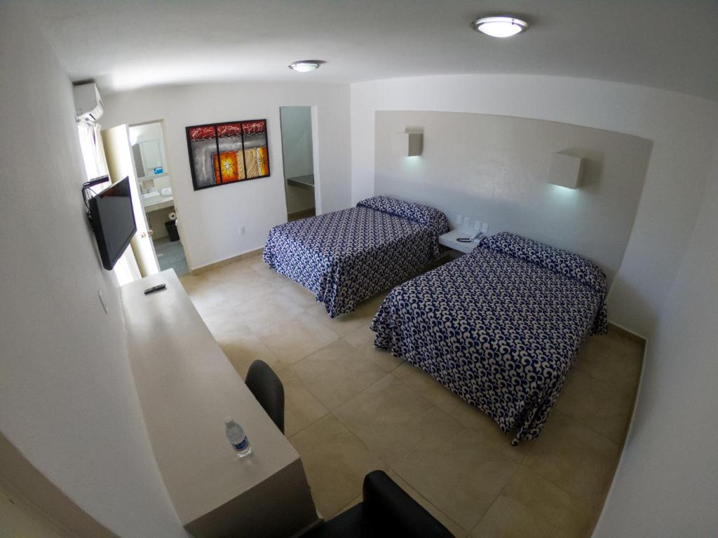 Postel nebo postele na pokoji v ubytování Hotel St. George
