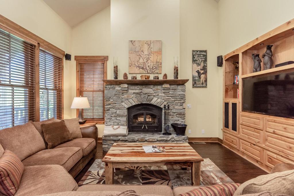a living room with a couch and a fireplace at Lodges 1132 in Mammoth Lakes