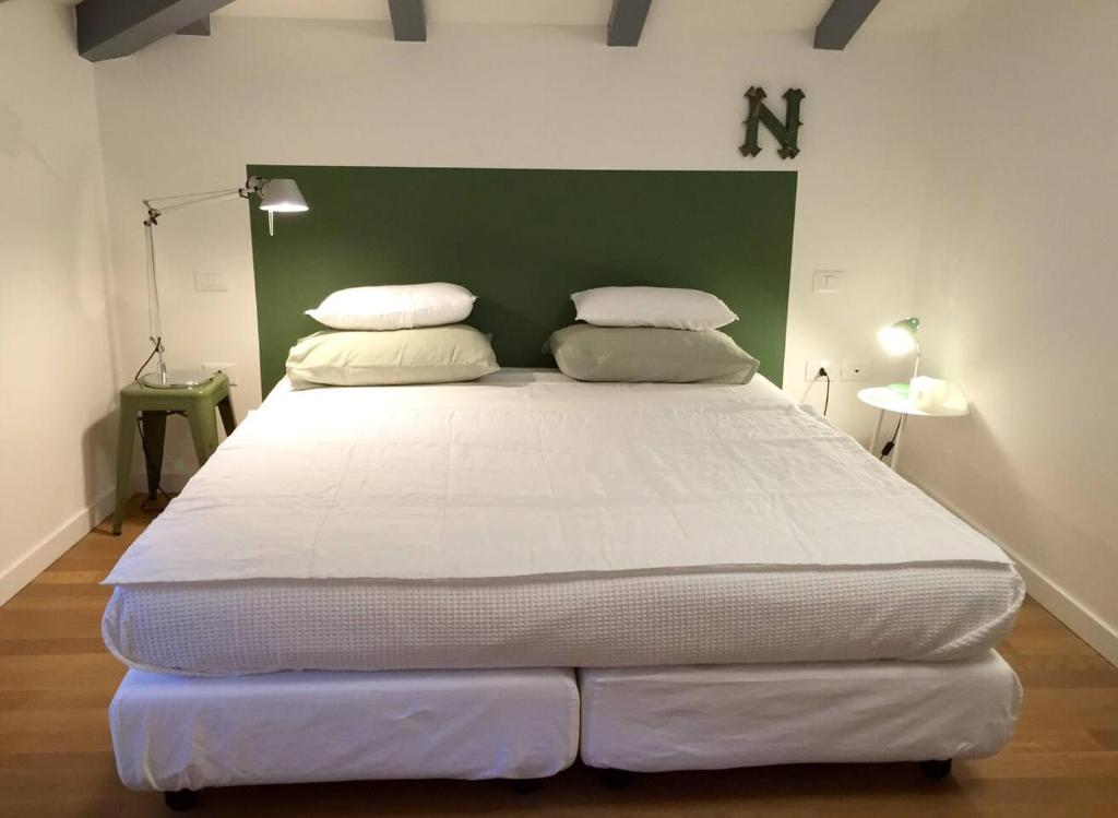 Posteľ alebo postele v izbe v ubytovaní Buonconsiglio apartment