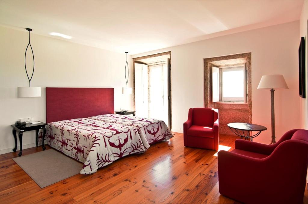 Postel nebo postele na pokoji v ubytování Hotel Convento dos Capuchos