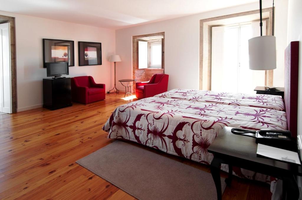 Postel nebo postele na pokoji v ubytování Hotel Convento dos Capuchos