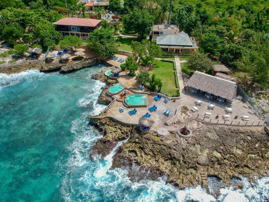 an aerial view of a resort and the ocean at The Westender Inn in Negril