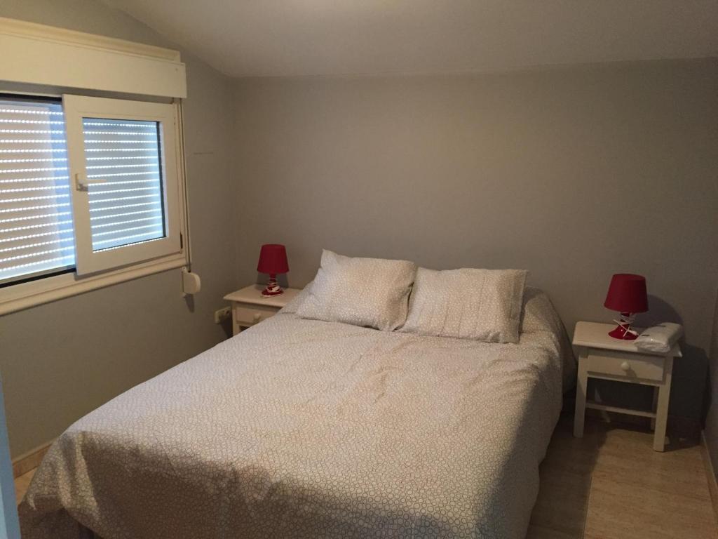 Posteľ alebo postele v izbe v ubytovaní Apartamentos Susa