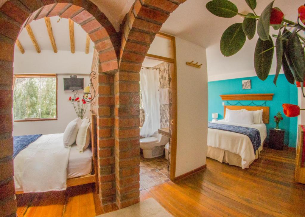 Postel nebo postele na pokoji v ubytování Parwa Guest House